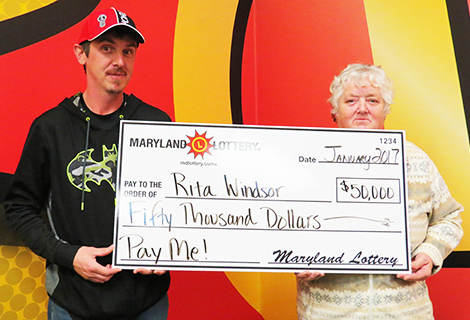 Rita Windsor of Hughesville and her son Wayne collected the first $50,000 top prize on the Pay Me! scratch-off.