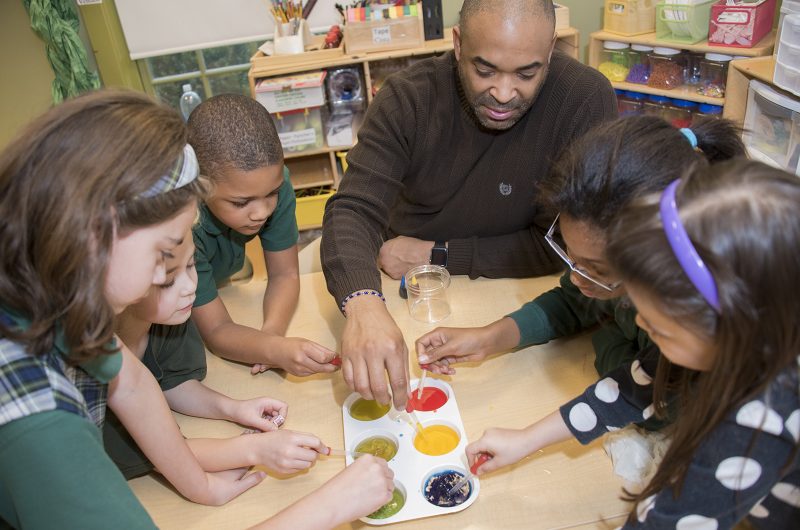 Albert “Ron” Swann, child care teacher for school-age children at St. Charles Children’s Learning Center at CSM, explains a concept to, from left, Claire, Page, Joshua, Kendall and Abigail. The center, which is located on the La Plata Campus, just received accreditation from the Maryland State Department of Education.