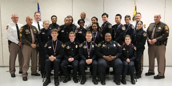 PICTURED: Front Row: Logan Steele, Eddie Vanover, Aidan Oakes, Jakob Gammons, Caroline Tristani; Middle Row: M/Cpl. Rhett Calloway, Kerrigan McMillen, Quincy Mitchell, Shawna McCarter, Nadia Corbett, Brandon Rodriguez, Jackie Zheng, Ethan Snider, Mederlyn Varela, Cpl. Travis Yates; Back Row: Capt. Kevin Barrows, Lt. Charly Baker, Jeremy Butler, Savanna Saunders, Sheriff Berry, Jabria Miles, Major Chris Becker