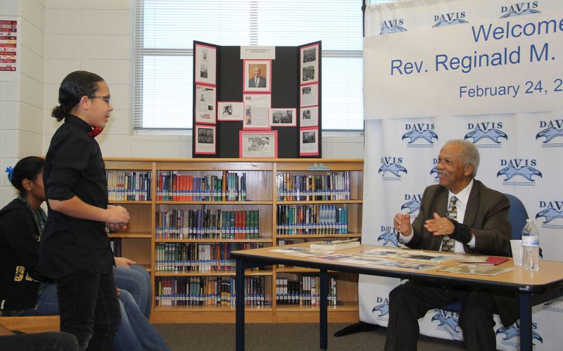 Theodore G. Davis Middle School seventh grader Michael Lawyer, II, left, talks with Rev. Reginald Green about his experiences as a Freedom Rider. Green visited Davis on Feb. 24 to speak to seventh graders about Freedom Rides during the civil rights movement. The students has just completed a lesson about the Freedom Riders during a unit for Black History Month. 