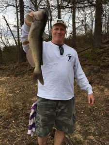 Courtesy of John Horgan, holding up a nice channel catfish he caught in Bush Creek while fishing with cut bait.