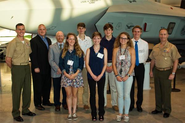 Winners of the Marine Corps Aviation Association (MCAA) John Glenn Squadron and The Annie Glenn scholarships. Pictured are (back row, left to right): Col. Steven Girard; Michael Watson, Leonardtown High School principal; Jake Heibel, Great Mills High School principal; Joey Crawford; Curtis Aaron; Dominic Ichniowski and Brig. Gen. Greg Masiello. Pictured in the front row are (left to right): Rylee Young; Michelle Beaulieu; and Anna Staats. In addition to the scholarship, winners also received a letter from MCAA, a squadron coin and a DVD of the movie “The Right Stuff.”