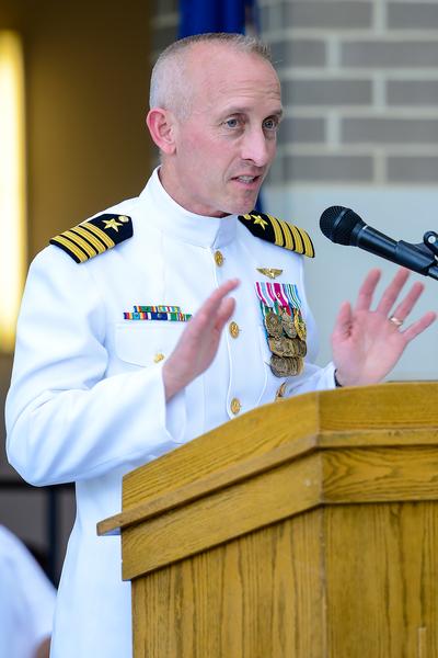 Navy Capt. Christopher McDowell speaks during his change of command ceremony May 25. McDowell, the former deputy program manager for the Air Combat Electronics Program Office (PMA-209), assumed the role of program manager during the ceremony at NAS Patuxent River, Maryland. As PMA-209’s program manager, McDowell will be responsible for the Navy’s development, integration and cradle-to-grave sustainment for common avionics solutions in safety, connectivity, mission computing and interoperability. (U.S. Navy photo)