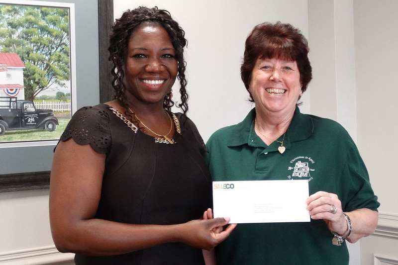 On behalf of CoBank, SMECO’s community and public affairs director Natalie Cotton (left) presents a $1,500 contribution to Darene Kleinsorgen, Executive Director of Christmas in April St. Mary’s County. Matching contributions were also given to Christmas in April organizations in Calvert and Charles counties.