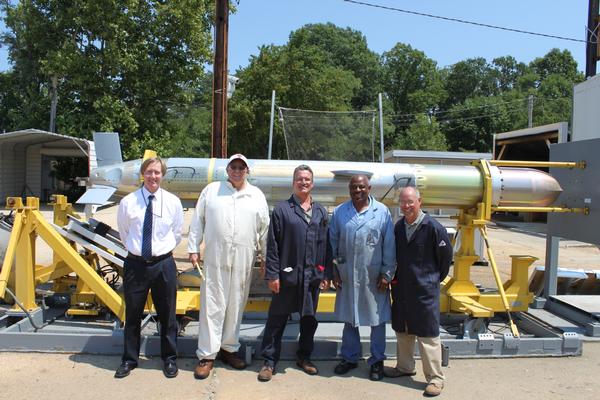 Members of the Functional Ground Test (FGT) team pose with the 4,000th Block IV Tomahawk cruise missile to come off the production line Aug.2 at the Naval Surface Warfare Center in Indian Head, Md. (U.S. Navy photo)