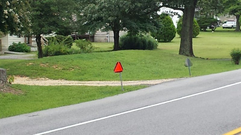 Improperly Displayed Slow Moving Vehicle sign