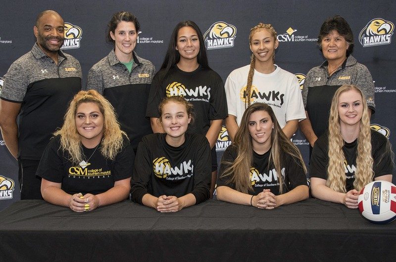 Newly signed Hawks volleyball players are, front row from left, Savannah Carroll, Alexis Lauer, Peyton Boelke and Alexandra Allen and, back row, next to Assistant Coach Ron Swann and Head Coach Ashley Wolfe, Reagan Tuiasosopo and Aliyah Jackson with Recruiting/Assistant Coach Nila Straka. 