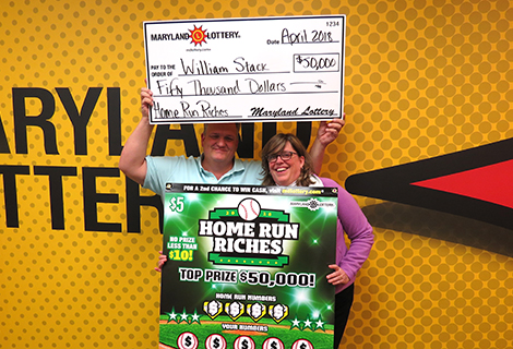 Bill and Kim Stack of Lusby celebrate his $50,000 Home Run Riches scratch-off win.