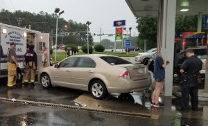 Police and Rescue Personnel Respond to Overdose Victim at Hermanville Sunoco Gas Pumps