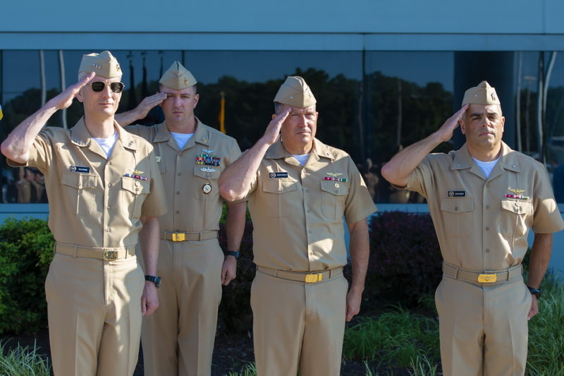 NAVAIR Commander, Vice Adm. G. Dean Peters (left), Rear Adm. Shane G. Gahagan (middle) and Rear Adm. John S. Lemmon (right) salute during the change of command ceremony where Lemmon assumed leadership of Naval Air Warfare Center Aircraft Division from at Patuxent River, Md. on Wednesday, September 5, 2018.