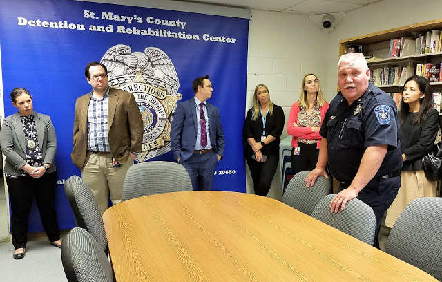 Major Michael Merican, right, speaks to members of the Maryland Department of Legislative Services at the St. Mary's County Detention and Rehabilitation Center. 