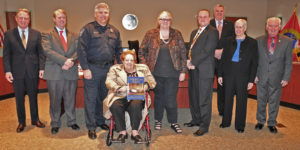 Linda Reno, center, with Sheriff Tim Cameron, the Commissioners of St. Mary's County, Grace Mary Brady and Carol Moody
