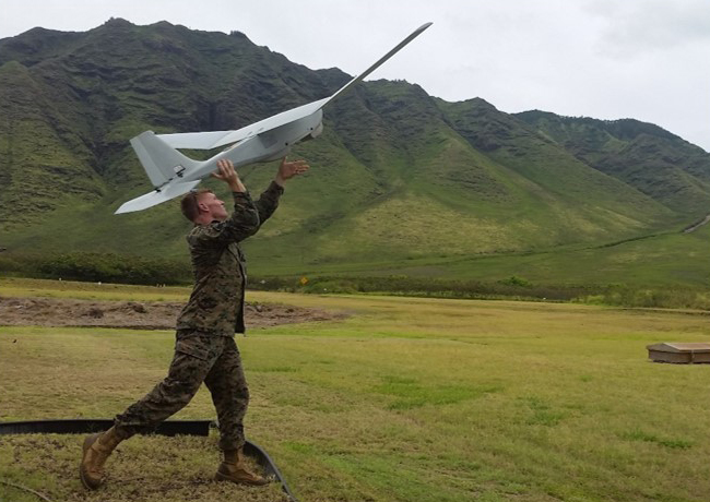 A Marine launches a RQ-20 Puma unmanned aircraft system (UAS) from Marine Corps Base Kaneohe Bay, Hawaii, as part of a Small UAS certification course taught at the Training and Logistics Support Activity (TALSA) Pacific. The facility opened its doors Nov. 5 and joins TALSA East and West coast facilities where Marines become qualified SUAS operators. (Photo courtesy U.S. Marine Corps)