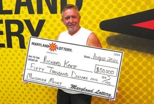 Richard Knott of Leonardtown is all smiles, thanks to his $50,000 Multiplier Money top-prize scratch-off win.