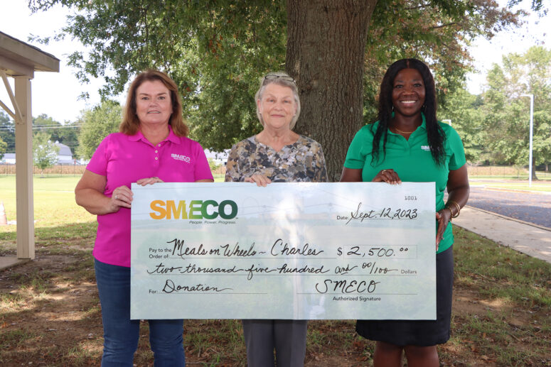 Jean Langley, route coordinator, Charles County Meals on Wheels, is presented with a check for $2,500 by Sonja Cox, SMECO president and CEO (left) and Natalie Cotton, SMECO government affairs and community relations director (right).