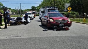 Police Investigating a Motor Vehicle Accident Involving a Mini-Bike
