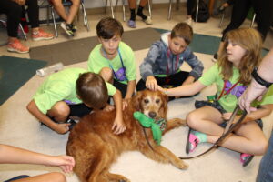 ‘Paws, Poses and Peace’ Combines Yoga and Therapy Dogs for All-Ages Wellness